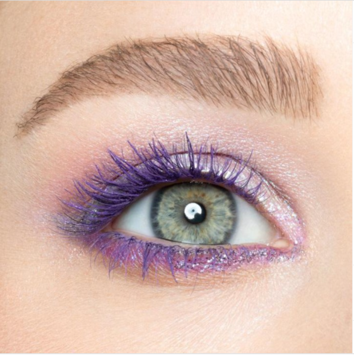 Green eyes with purple mascara.